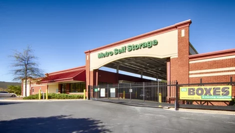 Front view of the gate and the Metro Storage Rex facility.