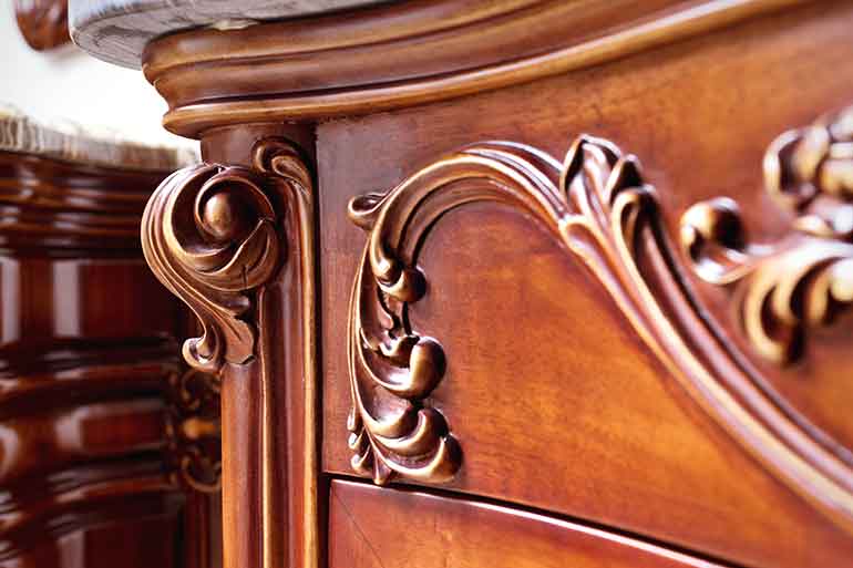 Ornately carved antique furniture.