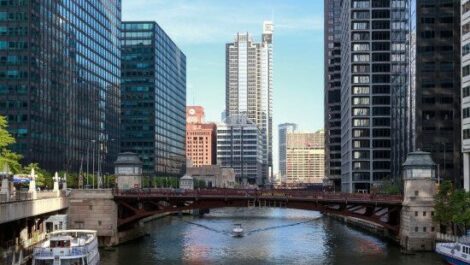 A view of the city of Chicago, overlooking a river and bridge