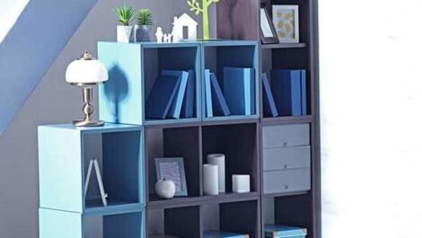 A book case holding bins, books, and decorative items.