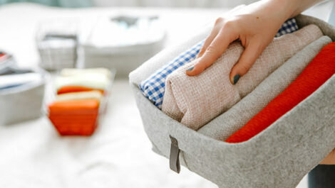 A basket with assorted towels being sorted.