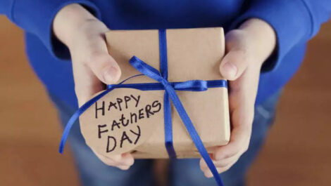 Person holding Father's Day gift.