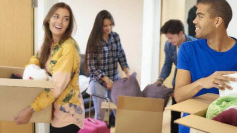 College students moving into their dorm rooms.