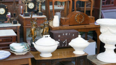 Several family heirlooms and vintage items sitting in a row.