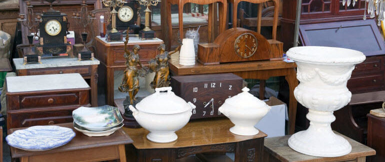 Several family heirlooms and vintage items sitting in a row.