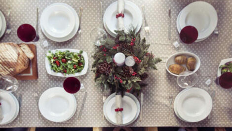 A table adorned with trays of holiday food.