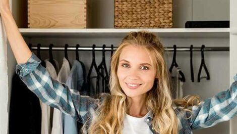 Woman standing in her closet.