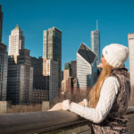 woman looking at Chicago skyline during winter