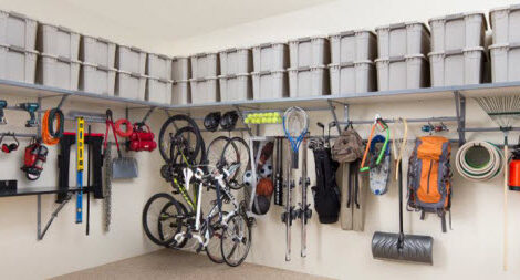 A garage equipped with shelves and other storage accomodations