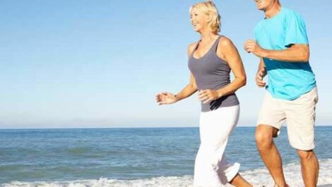 Retirees running along the beach in Florida.