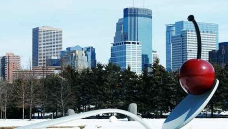 A wintery shot of the Minneapolis skyline, featuring a spoon monument with a cherry on top