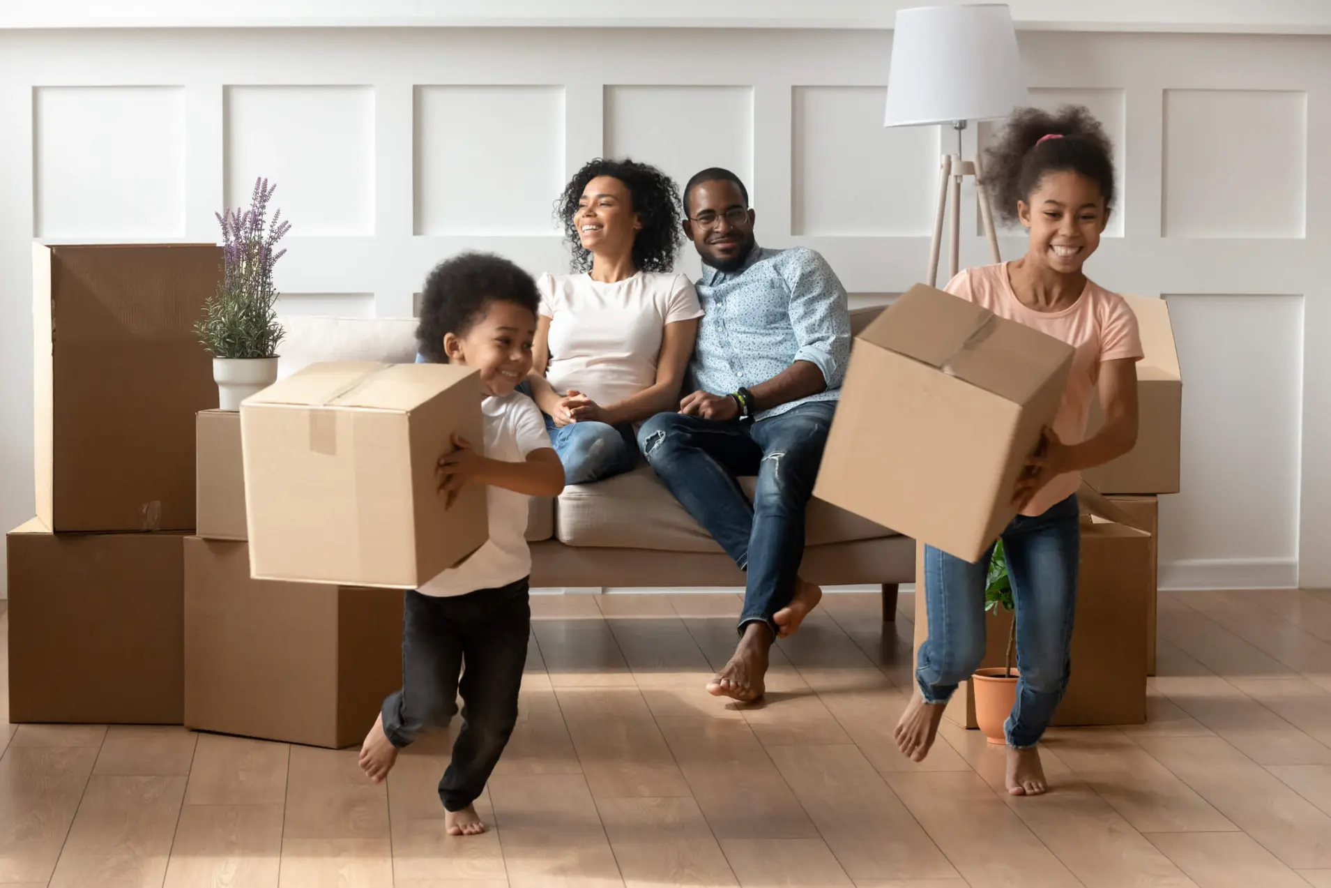 Happy children running with boxes in their hands. 