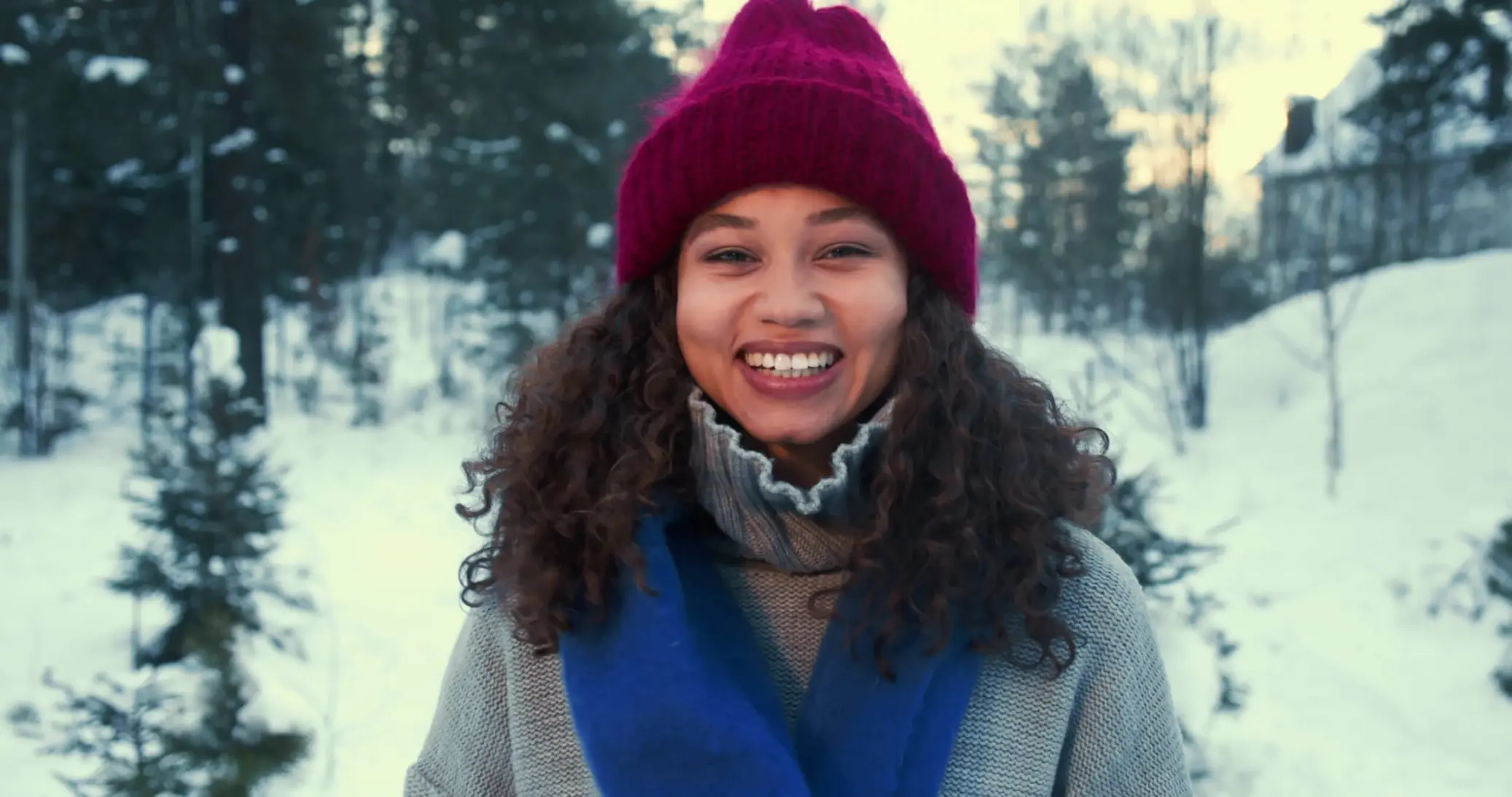 Smiling woman bundled up for the cold Minnesota weather.