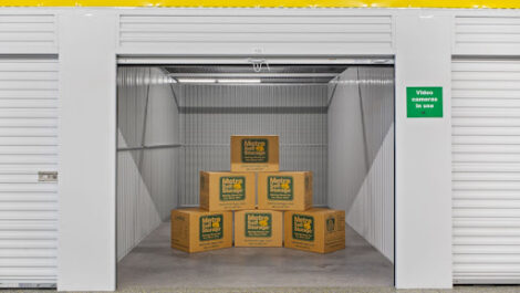 Branded Metro Self Storage boxes in an open storage unit.