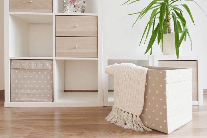 a small apartment with modular shelving units