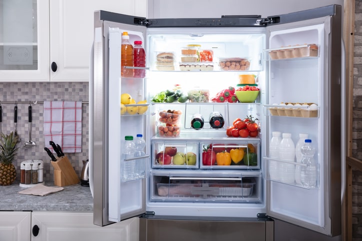 Open fridge displaying neatly organized produce.