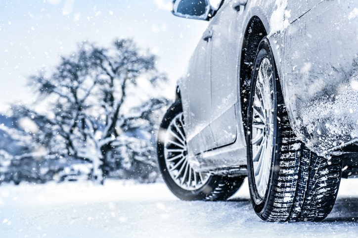 Side angle of a car driving in the snow