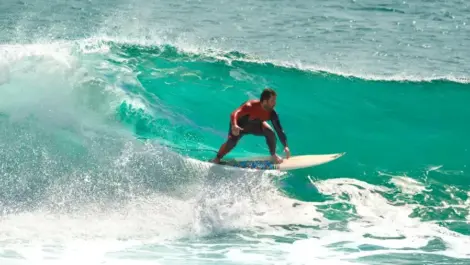 A surfer riding a wave