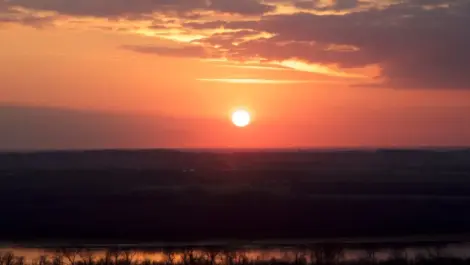 A deep orange sunset over a state park near Chicago