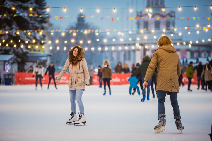 Couple ice skating in Millennium Park