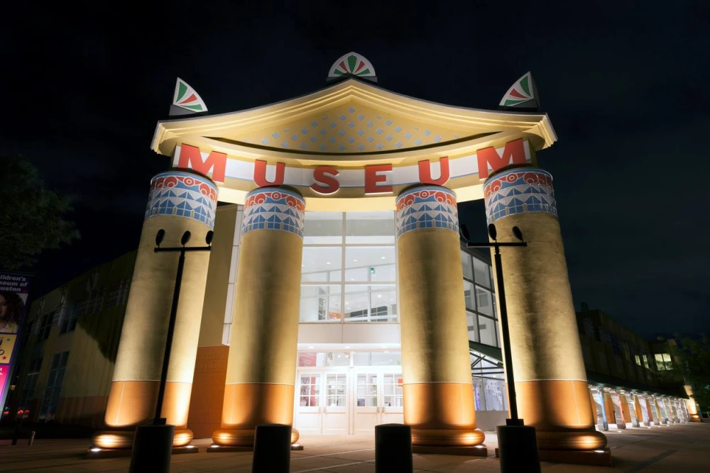 The entrance to the Children’s Museum of Houston illuminated at night