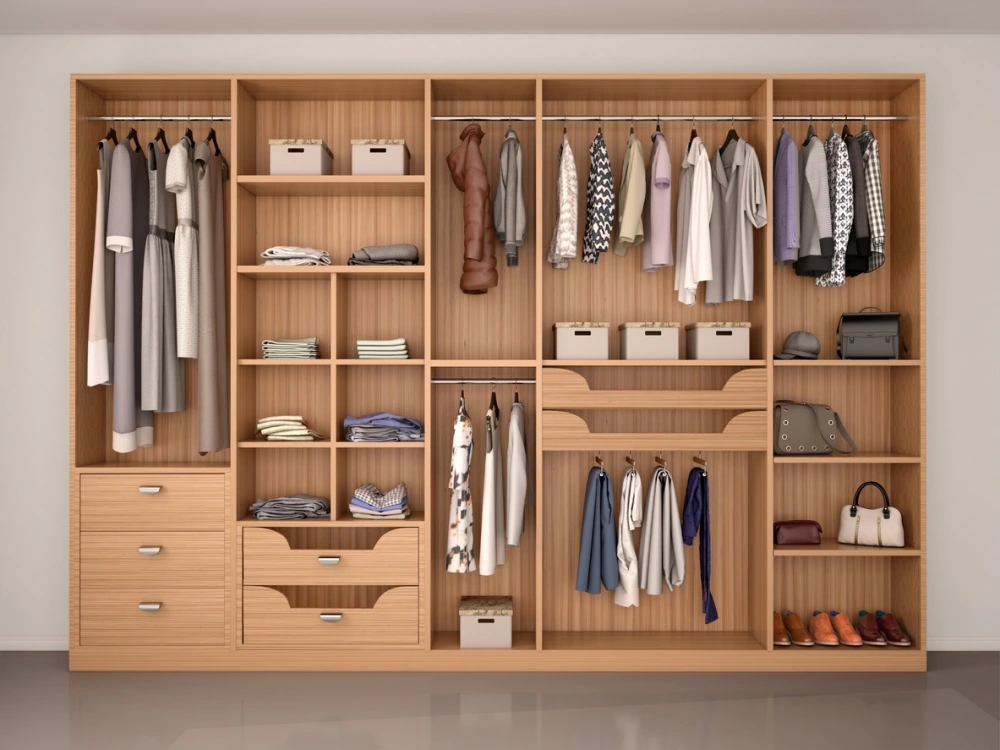 a well-organized wooden closet holding clothes, shoes, and bags
