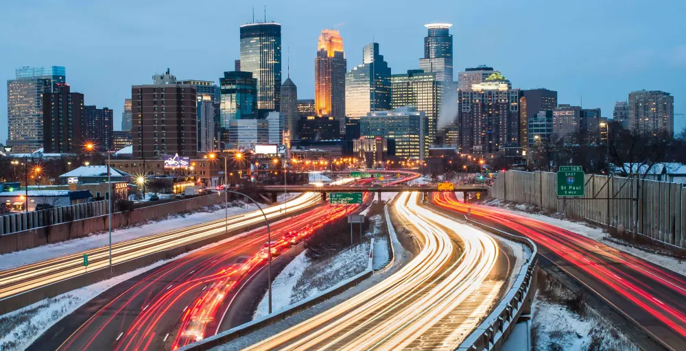 Minneapolis skyline in the winter during rush hour.