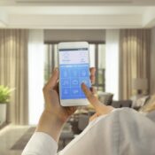 Woman using smart home app on phone