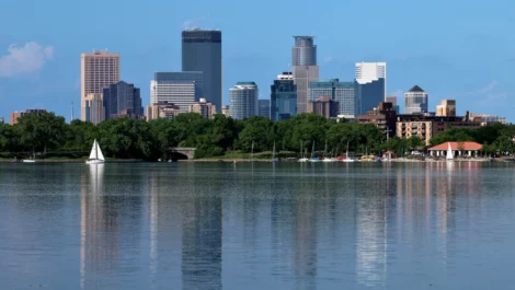 Minneapolis skyline reflecting off of lake Calhoun.