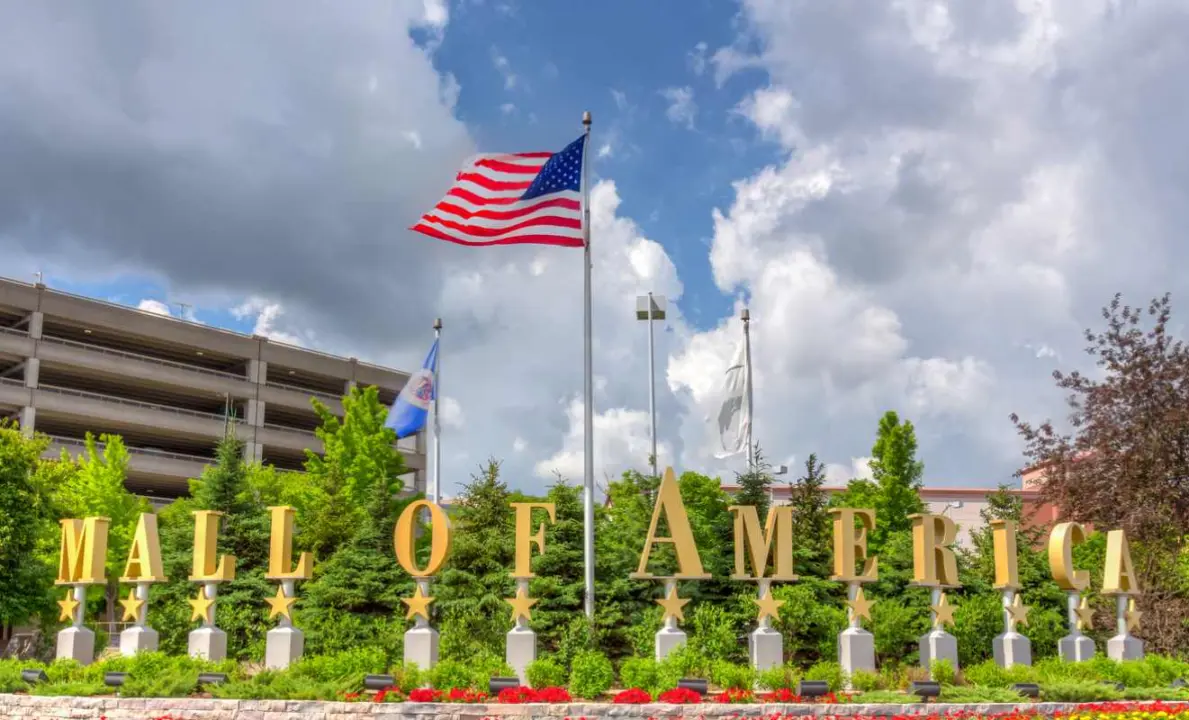 Entrance to the Mall of America with American flag blowing. 