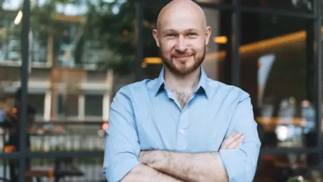 Portrait of Adult smiling man forty cafe